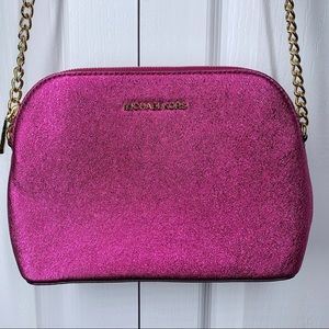 Michael Kors hot pink foiled crossbody bag.